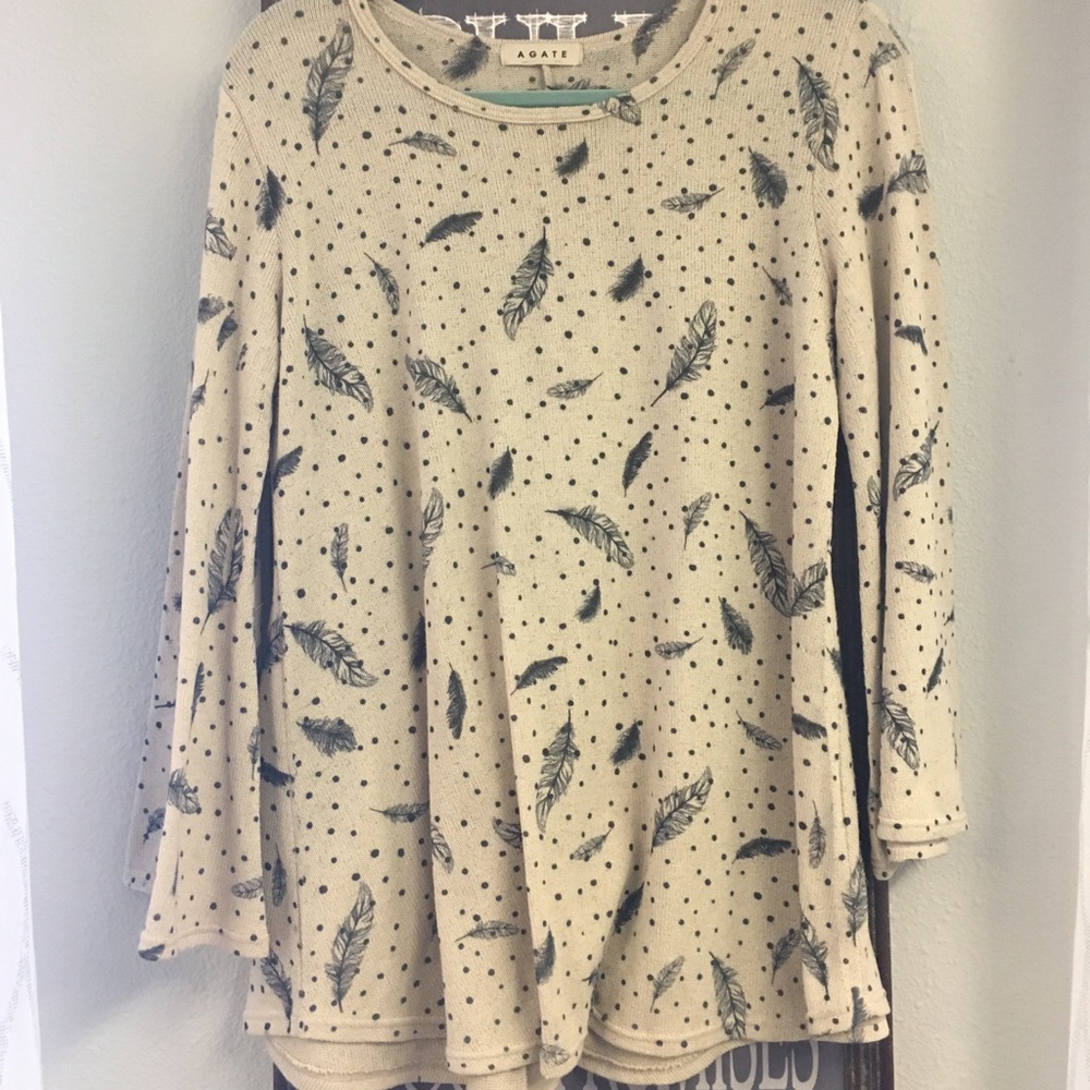 Comfortable tan with feathers shirt!